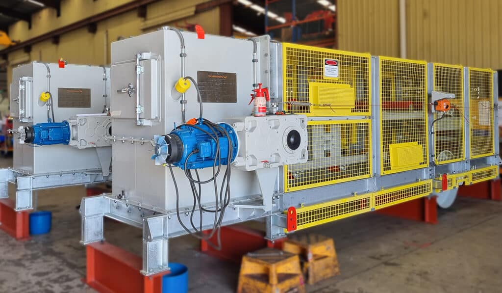 Bulk Handling Technologies (BHT) has designed and delivered two steep angle sidewall conveyors for a grinding media loading application at an Indonesian gold mine.