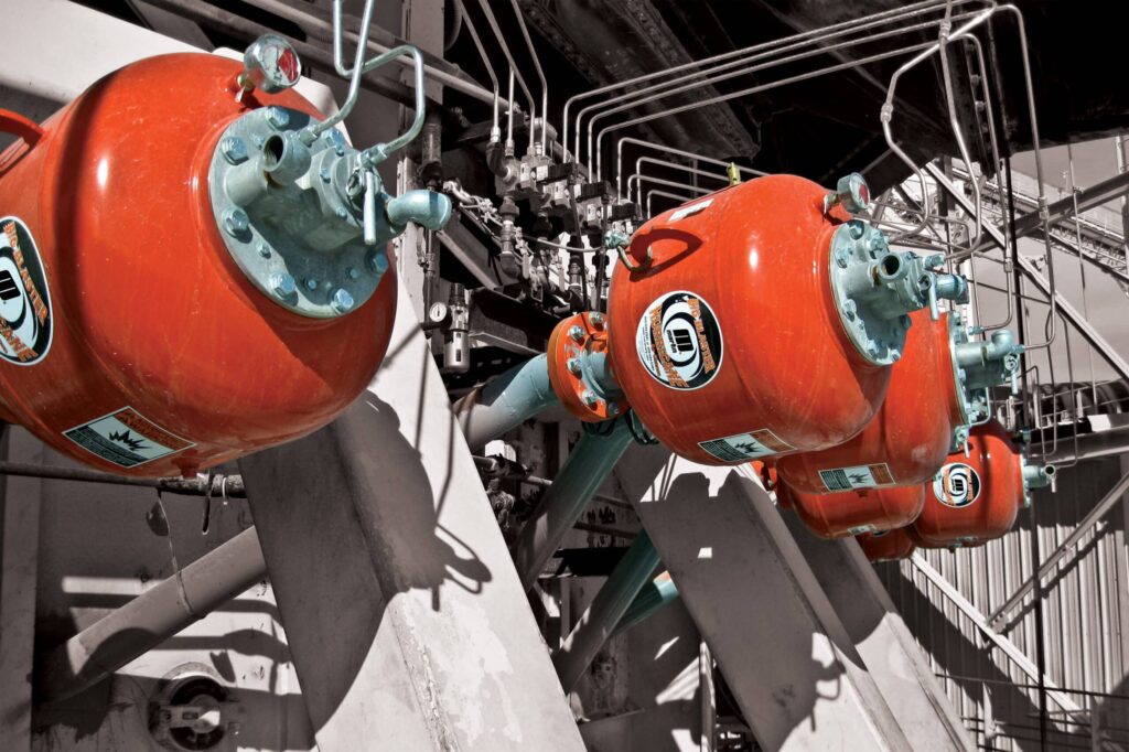 A series of air cannons can be programmed to deliver precisely-timed discharges for maximum benefit. Image: Martin Engineering